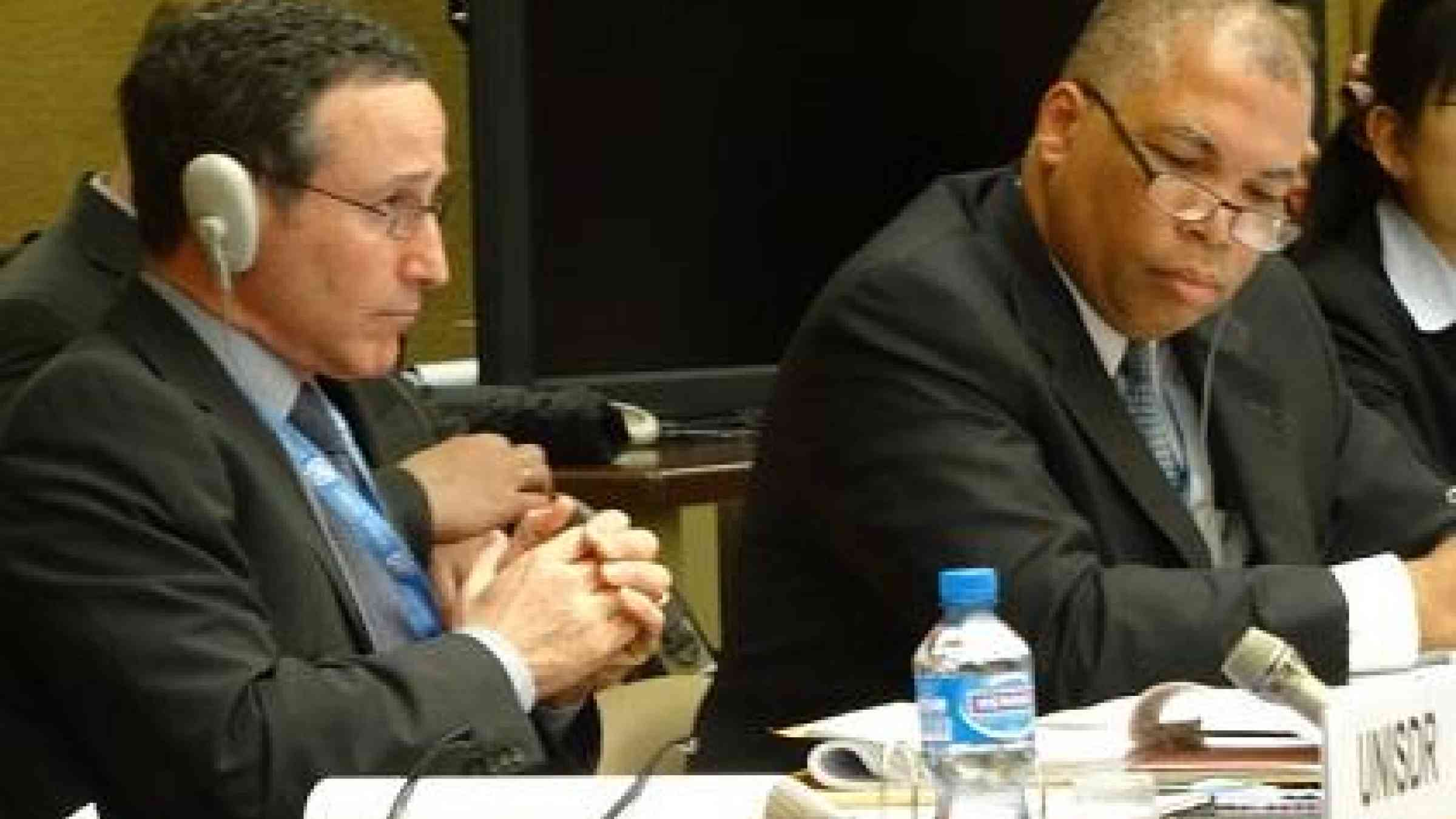 Mr. Robert Glasser, head of the UN Office for Disaster Risk Reduction (left) and meeting chair Mr. Wayne McCook, Jamaica's UN ambassador (right), listen as delegates take the floor to comment (Photo: UNISDR)