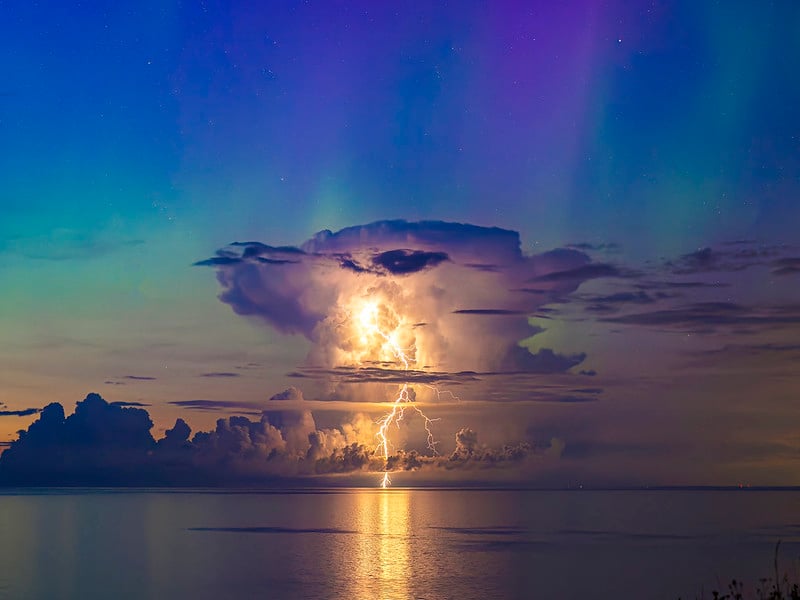  northern lights alongside a thundercloud.