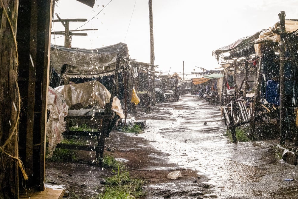 African open air market while raining
