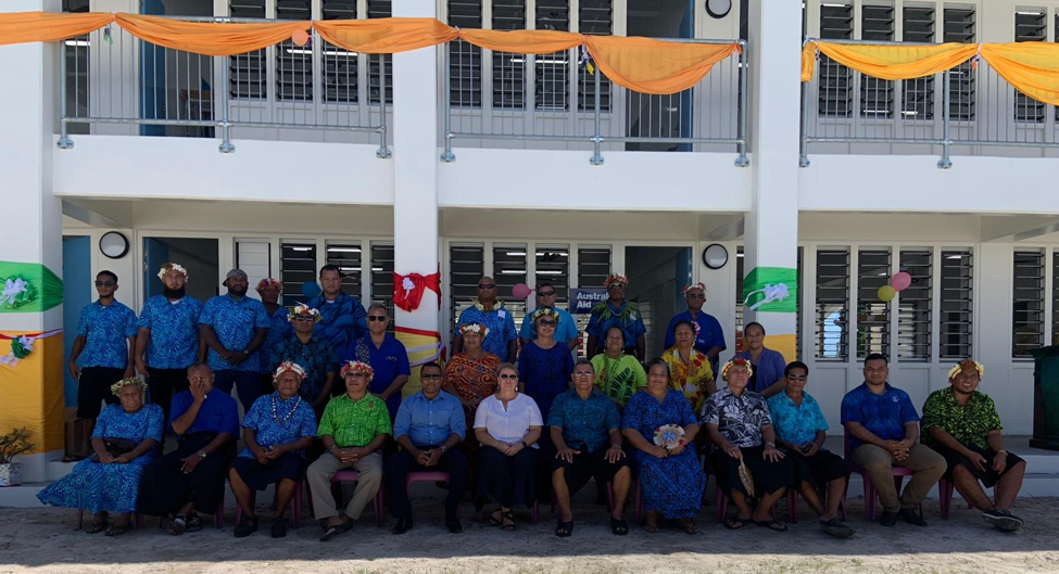 Australian and Tuvalu officers in front of the new classroom building. 
