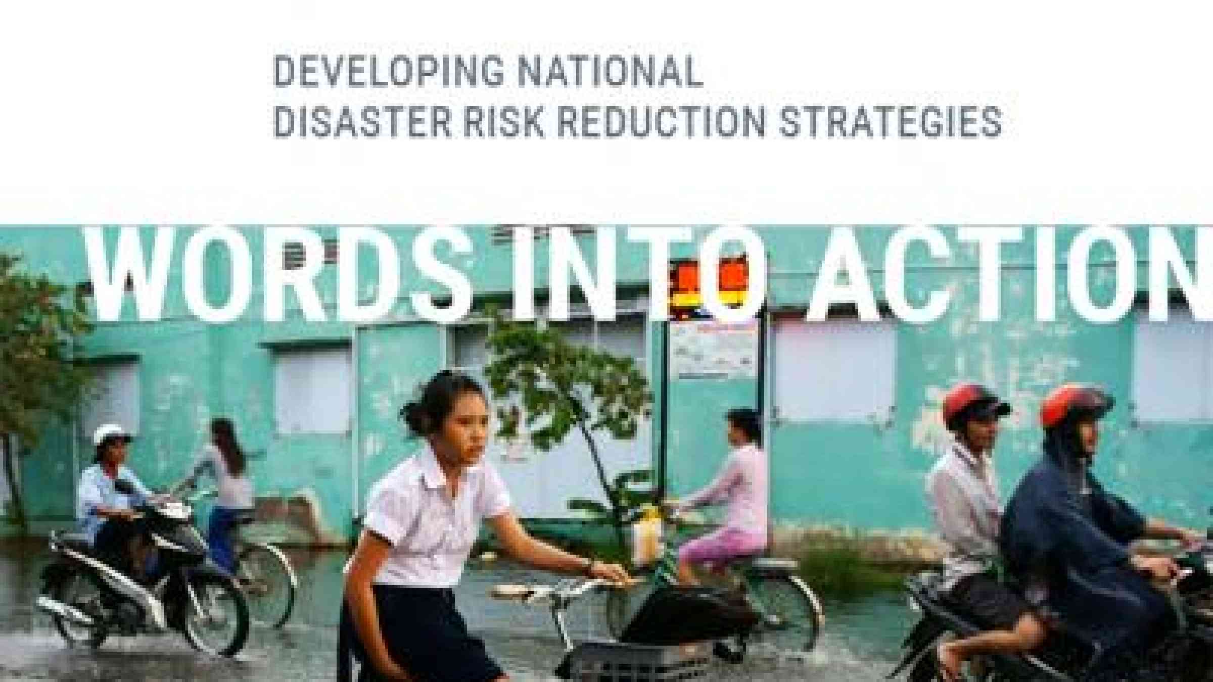 Image of girl on bicycle in a flooded street as the cover image of Words into Action: Developing National Disaster Risk Reduction Strategies