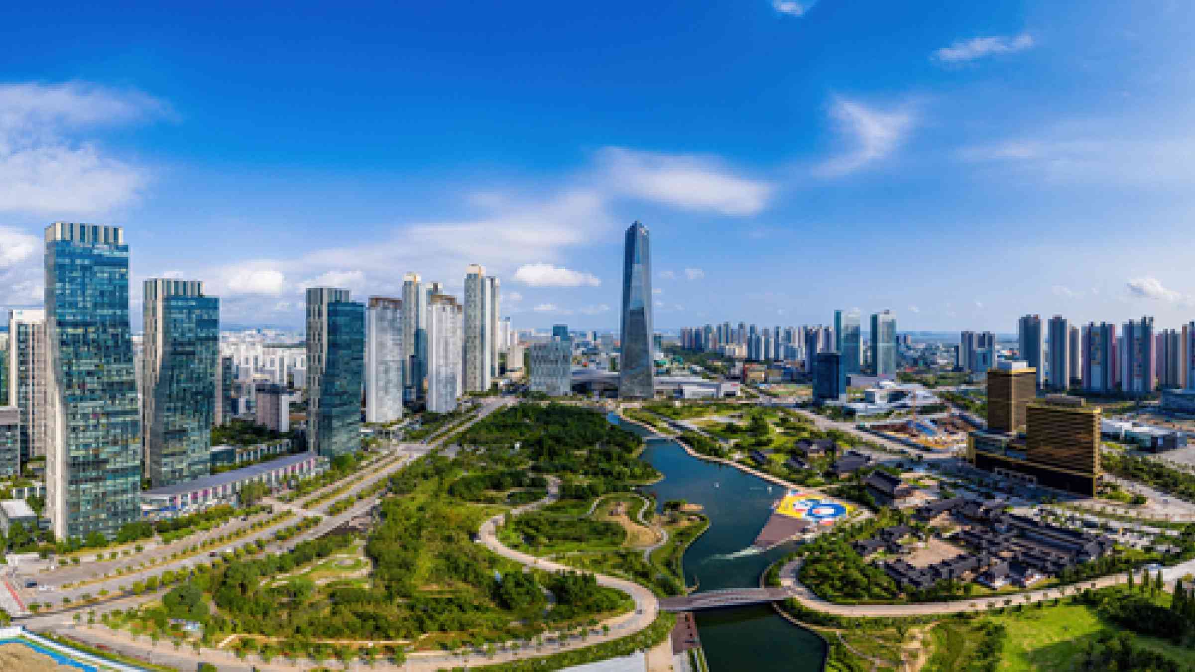 image of Songdo, Yeonsu-gu, Incheon, South Korea - September 3, 2020: Aerial and panoramic view of high rise apartments, Central Park and Northeast Asia Trade Tower