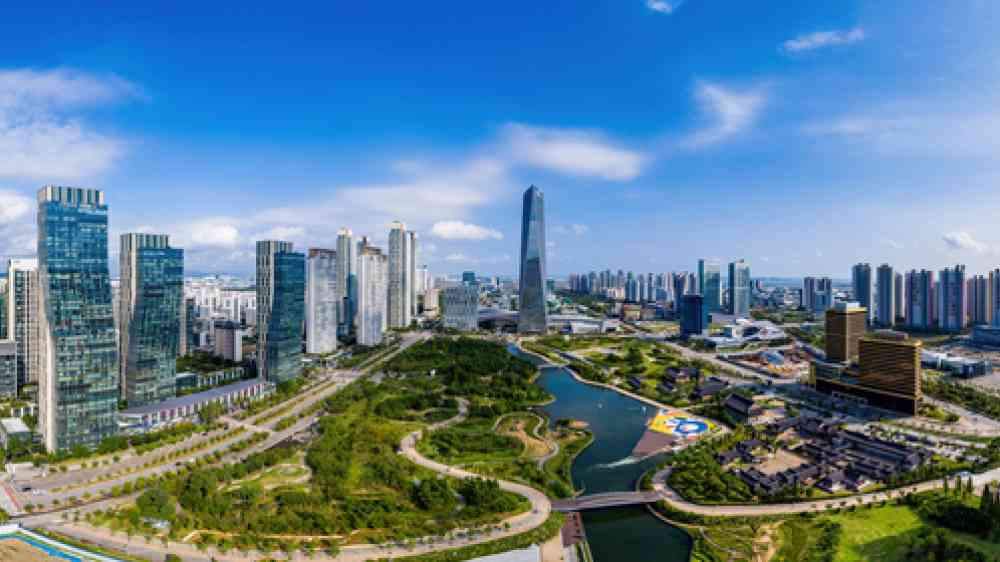 image of Songdo, Yeonsu-gu, Incheon, South Korea - September 3, 2020: Aerial and panoramic view of high rise apartments, Central Park and Northeast Asia Trade Tower