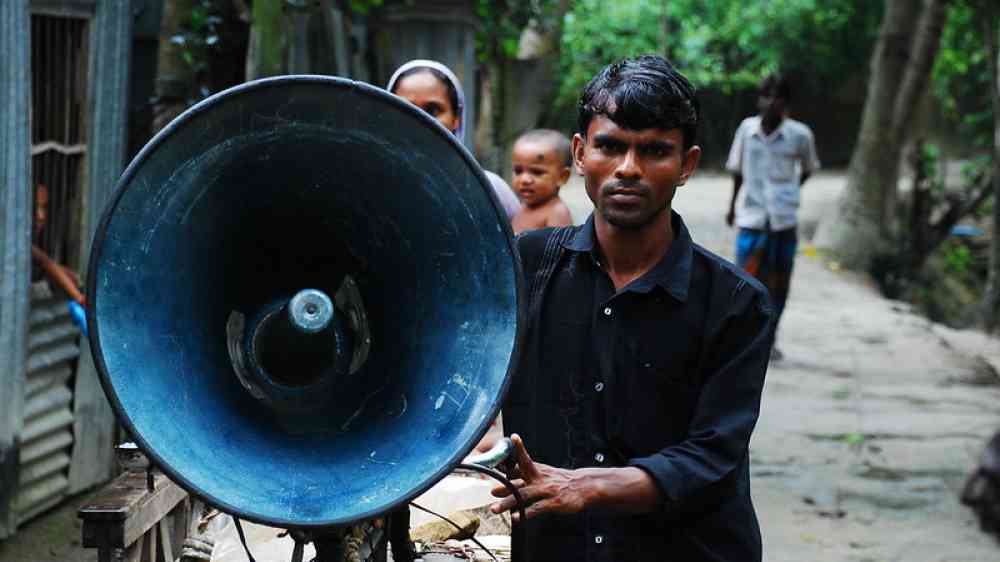 Man holding huge speaker