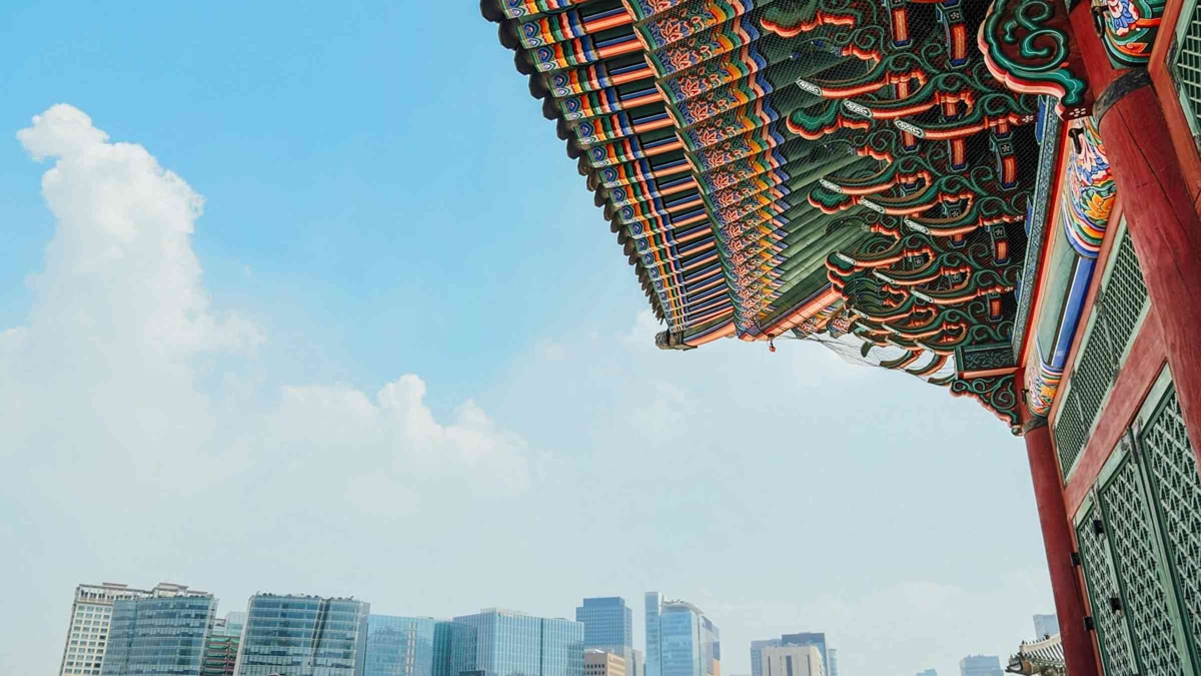photo of Korean traditional building and modern buildings in Seoul