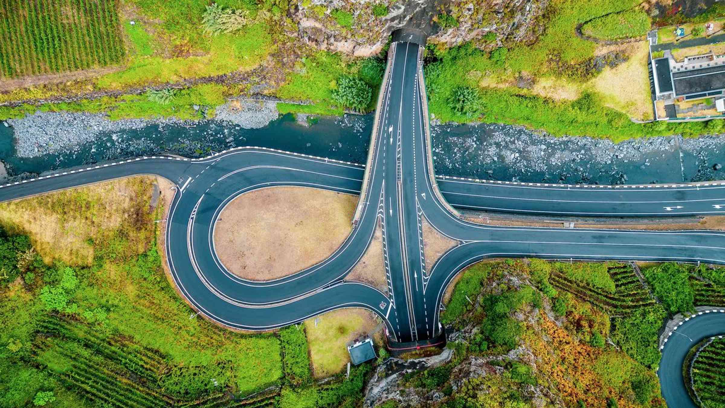Bird's eye view of the exit of an expressway located between two tunnel portals, Ribeira da Janela, Madeira, Portugal