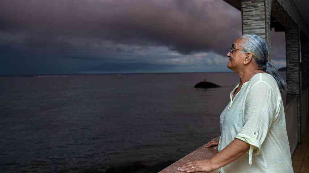 Woman looking at the ocean
