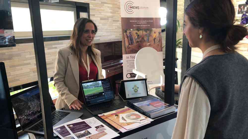 Rosalia Smaldone from Potenza is interacting with a visitor at Marketplace