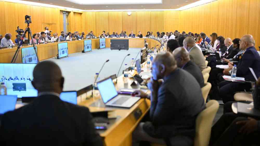 Conference room with participants in discussion.