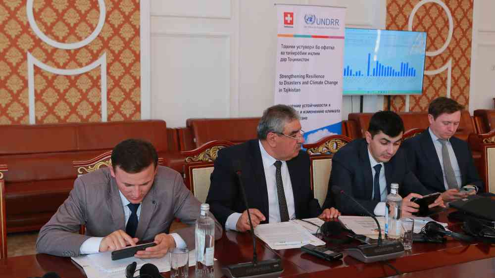 Participants answering the poll using their phones during the meeting
