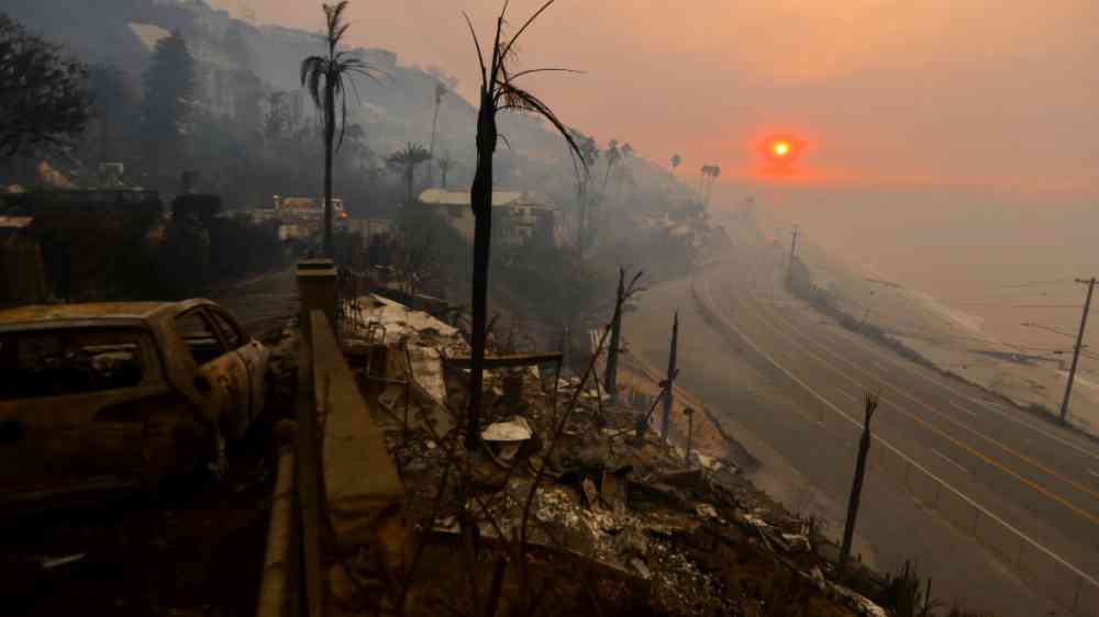 A sunrise casts its light over the Pacific Palisades neighborhood of West Los Angeles, in the aftermath of the 2025 wildfires.