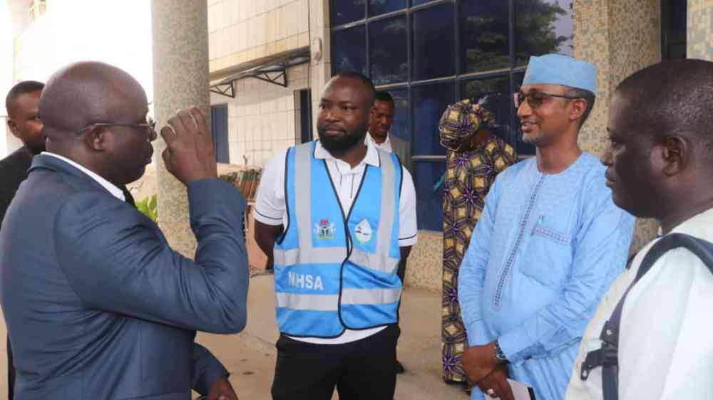 Participants of the Liberia-Nigeria study tour converse outside a building
