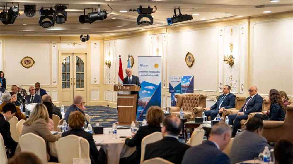 Consortium of Alexandria image of people sitting at a conference