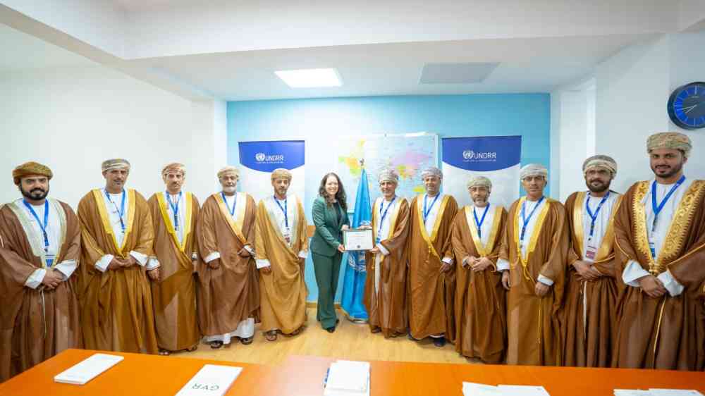 Ms Sandra Amlang standing with Salalah Delegation for celebrating becoming a resilience hub