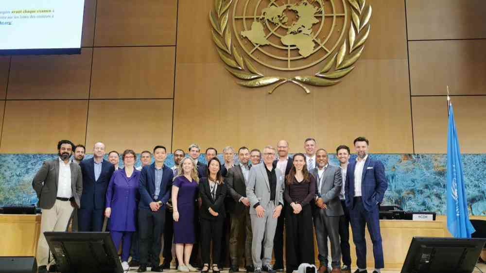 Participants of the event standing on a stage