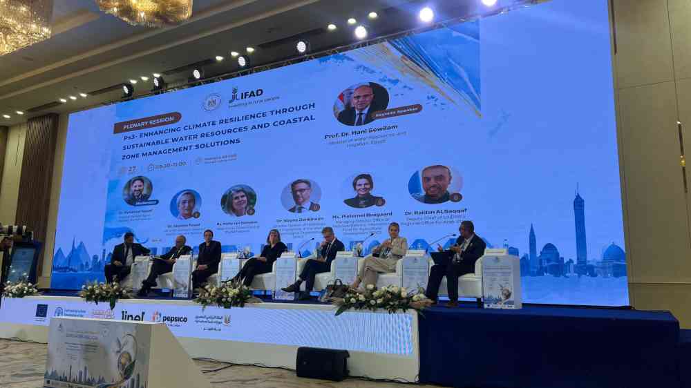 Panelists discuss climate resilience, sustainable water resources, and coastal zone management during a plenary session at Cairo Water Week 2026, with UNDRR Deputy Chief Raidan Al Saqqaf among the speakers.