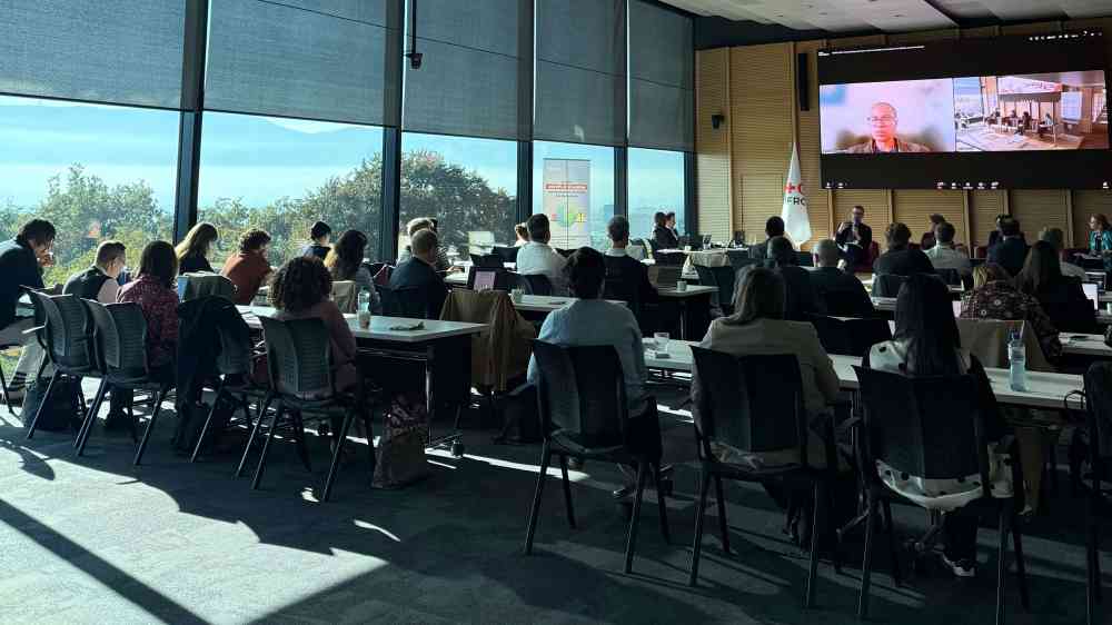 Photo of a meeting room with participants
