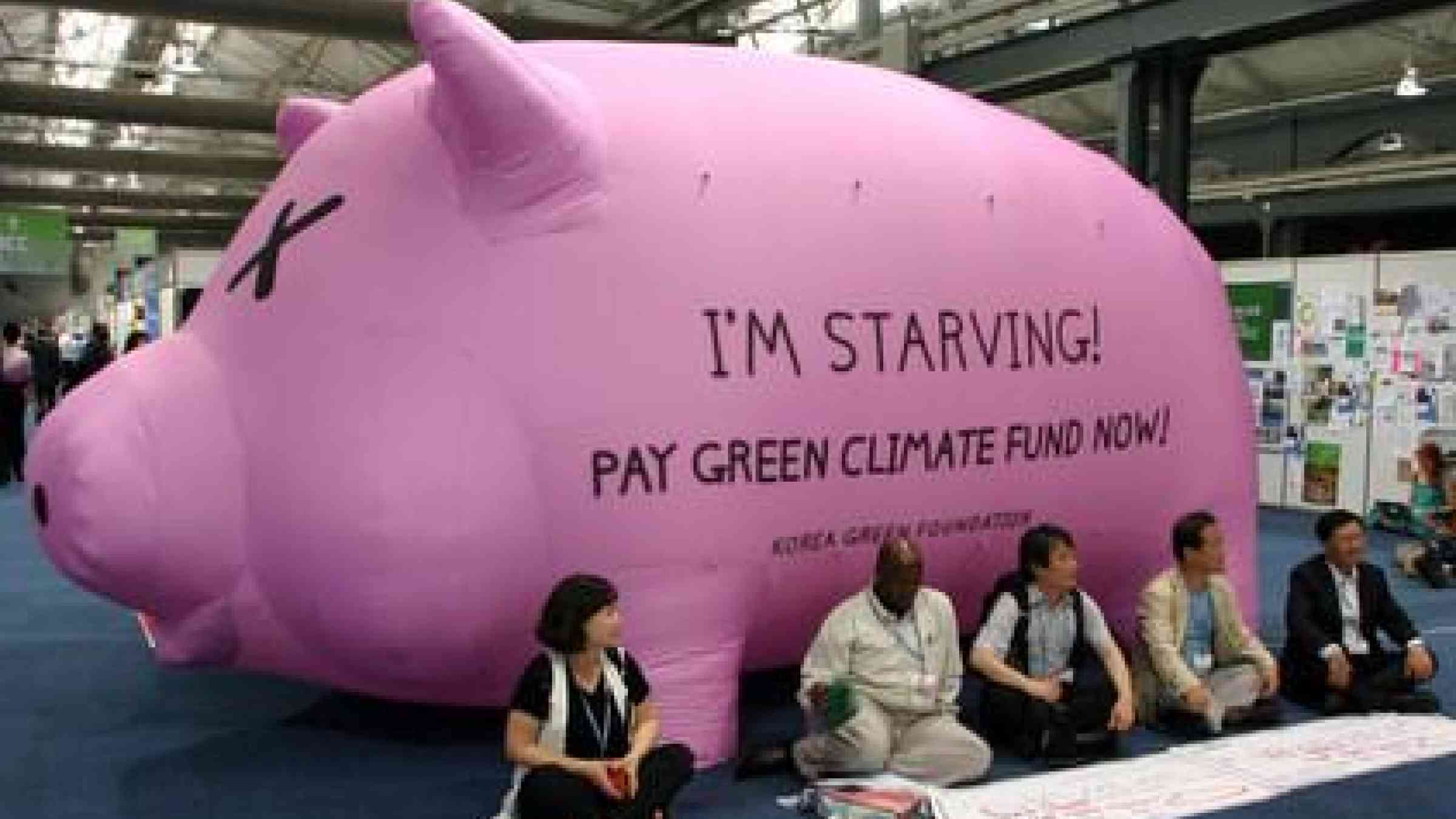 Impromptu protest by the Korea Green Foundation at COP17 challenges rich nations  to contribute to the Green Climate Fund.