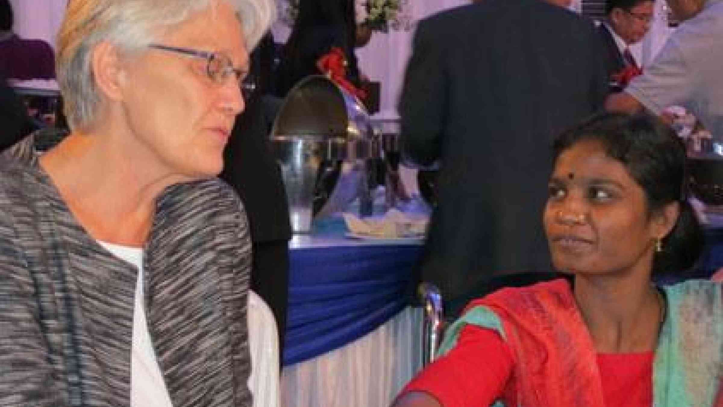 UNISDR chief Margareta Wahlstrom chatting with Kazol Rekha, a 24 year old disabled woman from Bangladesh whose life is featured in a winning entry at the first UNISDR Asian Film Festival on Disaster Risk Reduction.