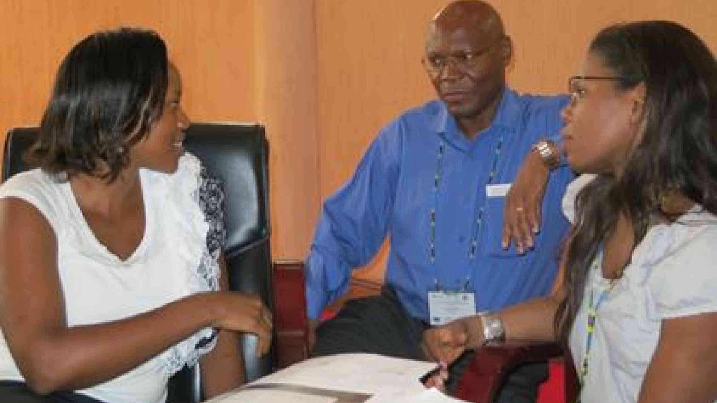 From left: Winnie Karanu, Microsoft Africa Initiative, Joseph Ogutu, Safaricom, chatting with UNISDR's private sector focal point, Kiki Lawal, at the launch of the private sector initiative at the 4th Africa Platform for Disaster Risk Reduction.