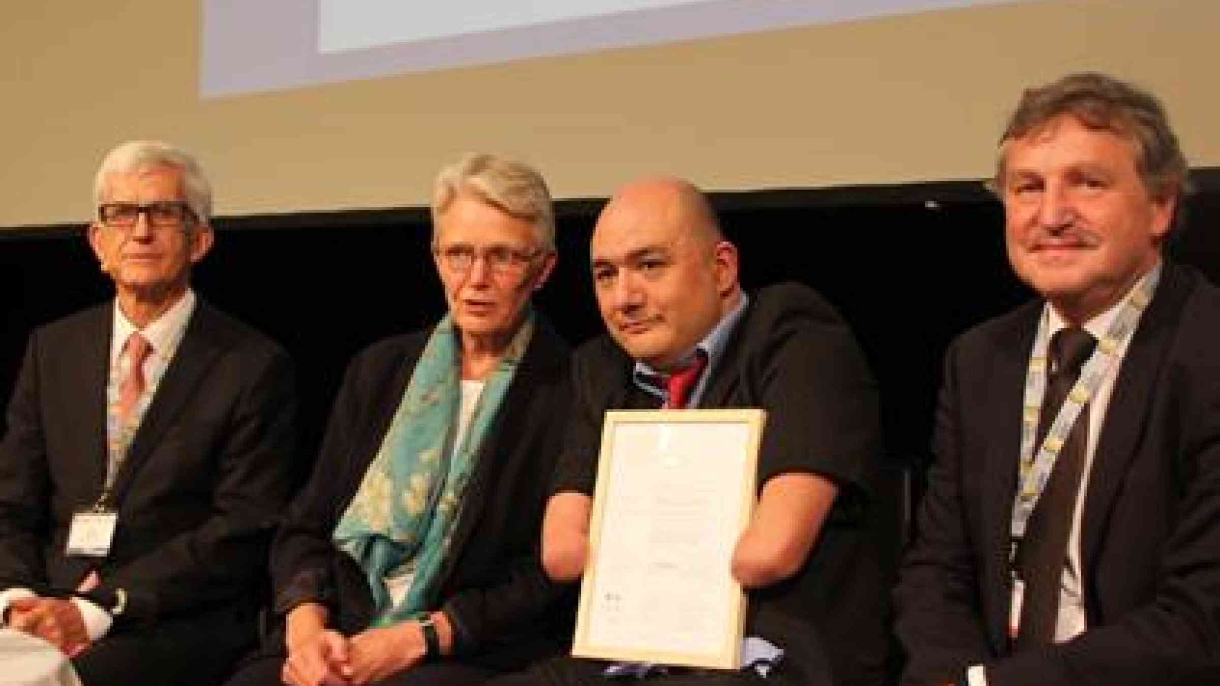 At the 2014 Risk Award ceremony in Davos (from left):  Walter J. Amman, Global Risk Forum; Margareta Wahlstrom, UNISDR; award winner Carlos Kaiser, Inclusiva NGO;  and Thomas Loster, MunichRe Foundation. (Photo: UNISDR)