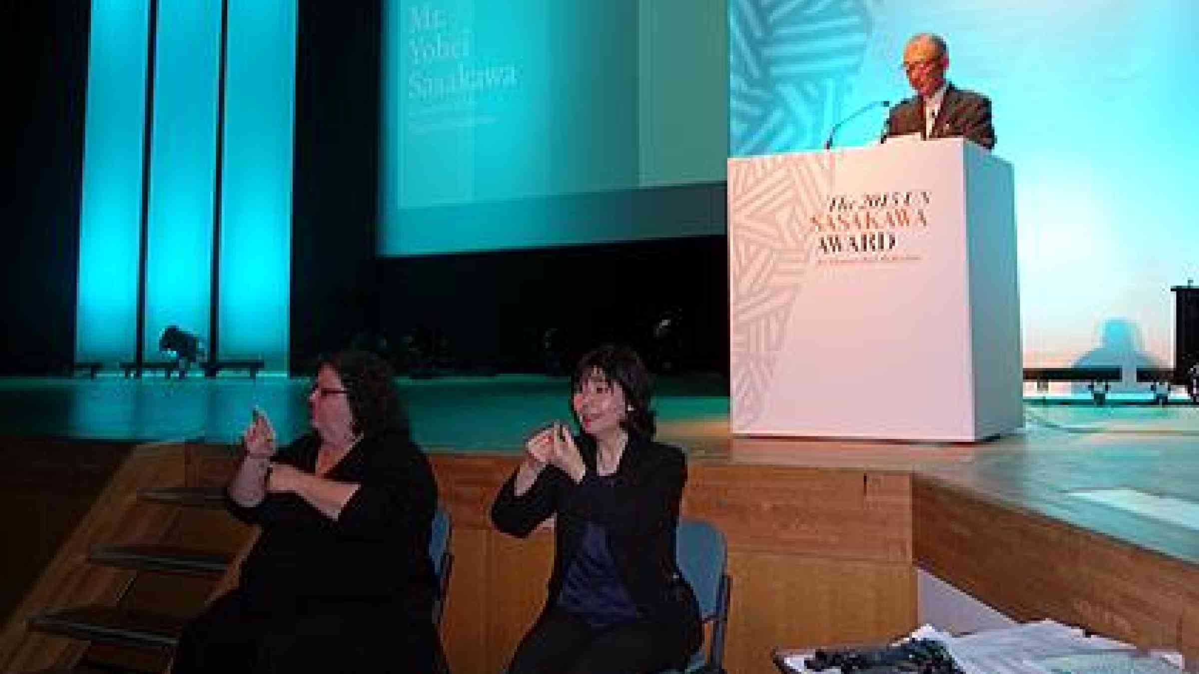 Interpreters using sign language during the Sasakawa Awards ceremony at the World Conference on Disaster Risk Reduction in Sendai, Japan. (Photo: UNISDR)