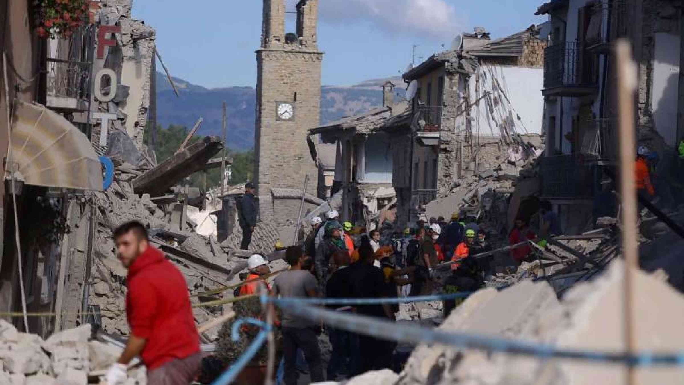 Rescue workers at the scene of  last Wednesday's earthquake