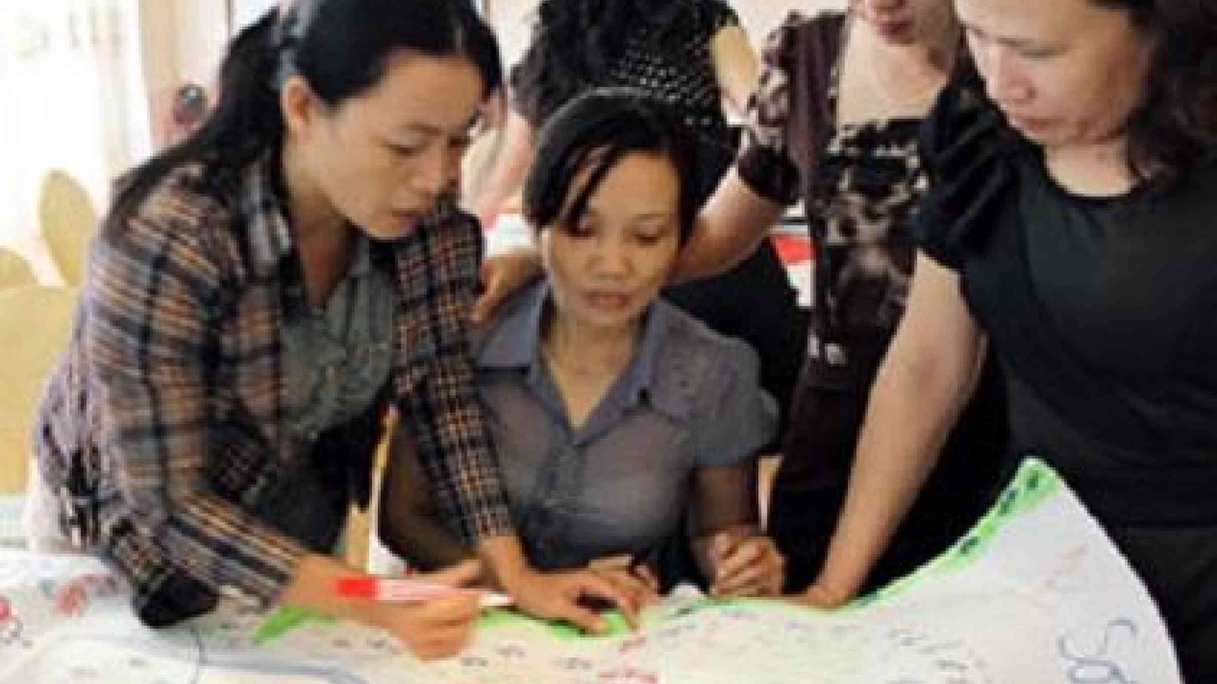 Women in Vietnam working on a hazard map for their community (Credit: UN Women)