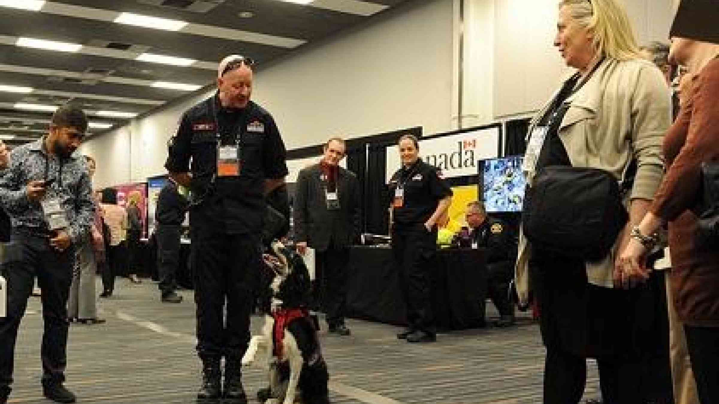 Baillie the Border Collie, a highly-skilled search and rescue dog, pictured here with her handler Mr. Kit Huffer, has become a star at the Americas region's top disaster risk reduction conference (Photo: Public Safety Canada/UNISDR)