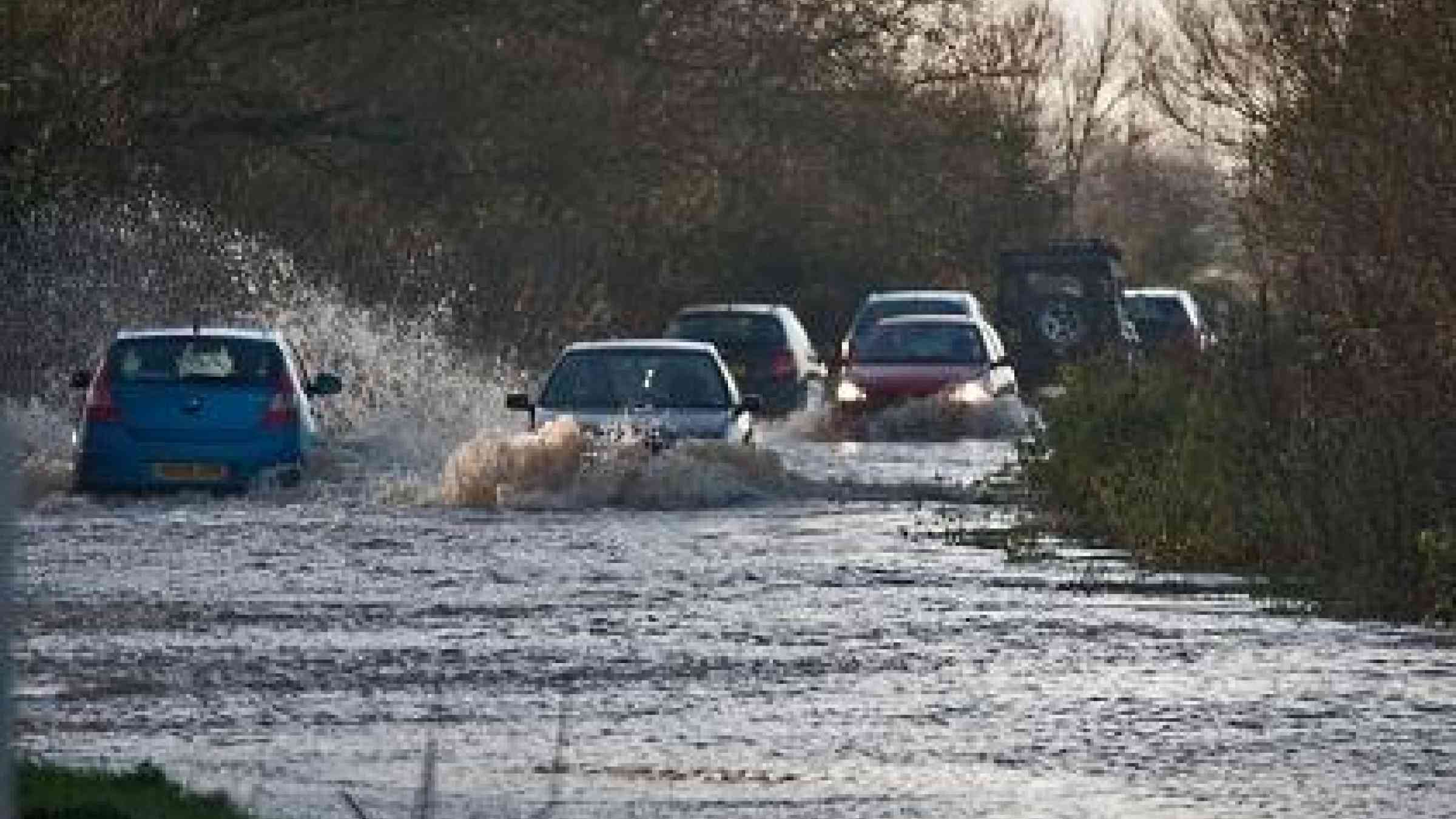 A flooded road road near Glastonbury, UK in 2012 (Photo CC Flickr: Mark Robinson)