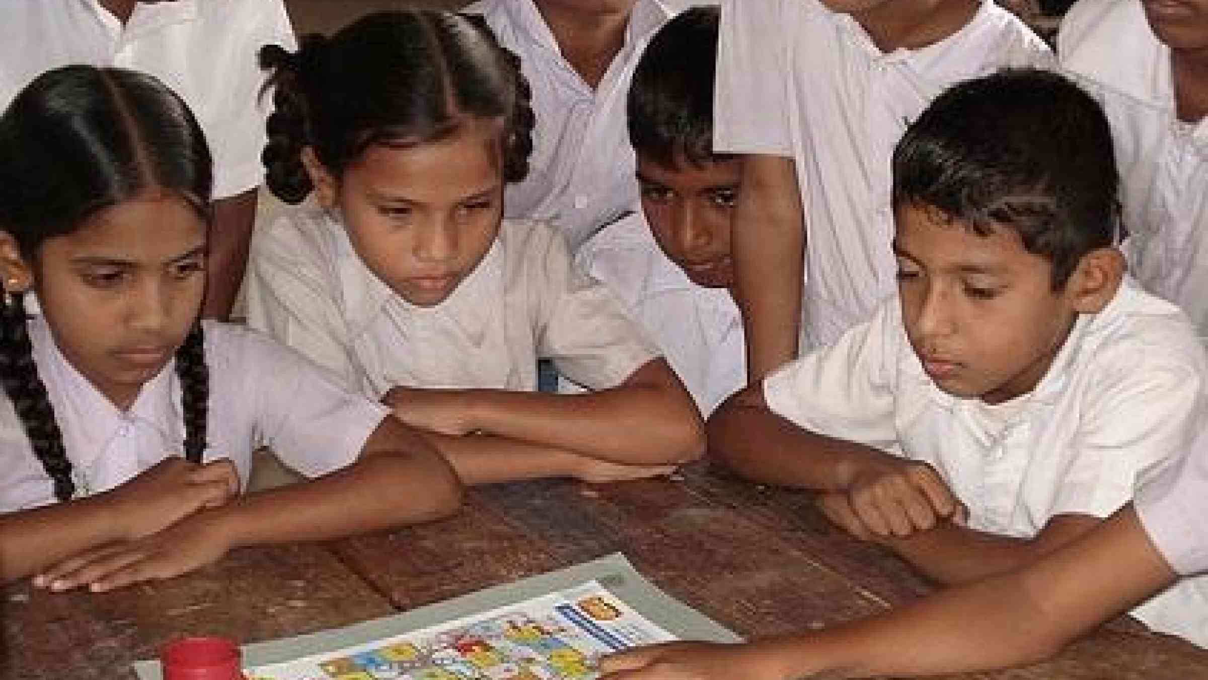 Children playing 'Riskland,' a game which creates awareness about natural hazards and how to prepare.  Photo credit: UNDP Sri Lanka