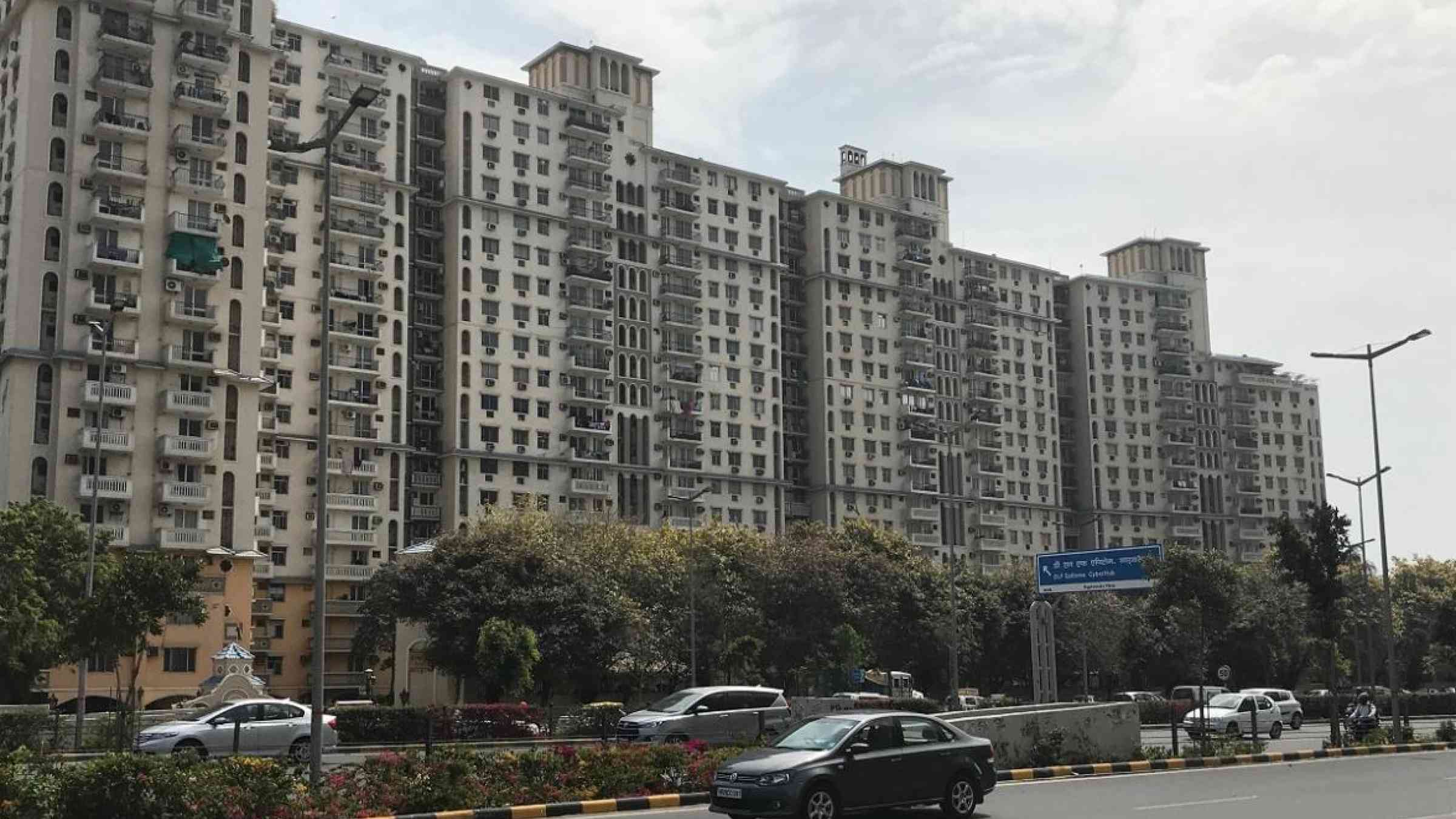 A view of high rise apartment blocks in Delhi with a "soft storey" for parking on the ground floor making them more vulnerable to earthquakes