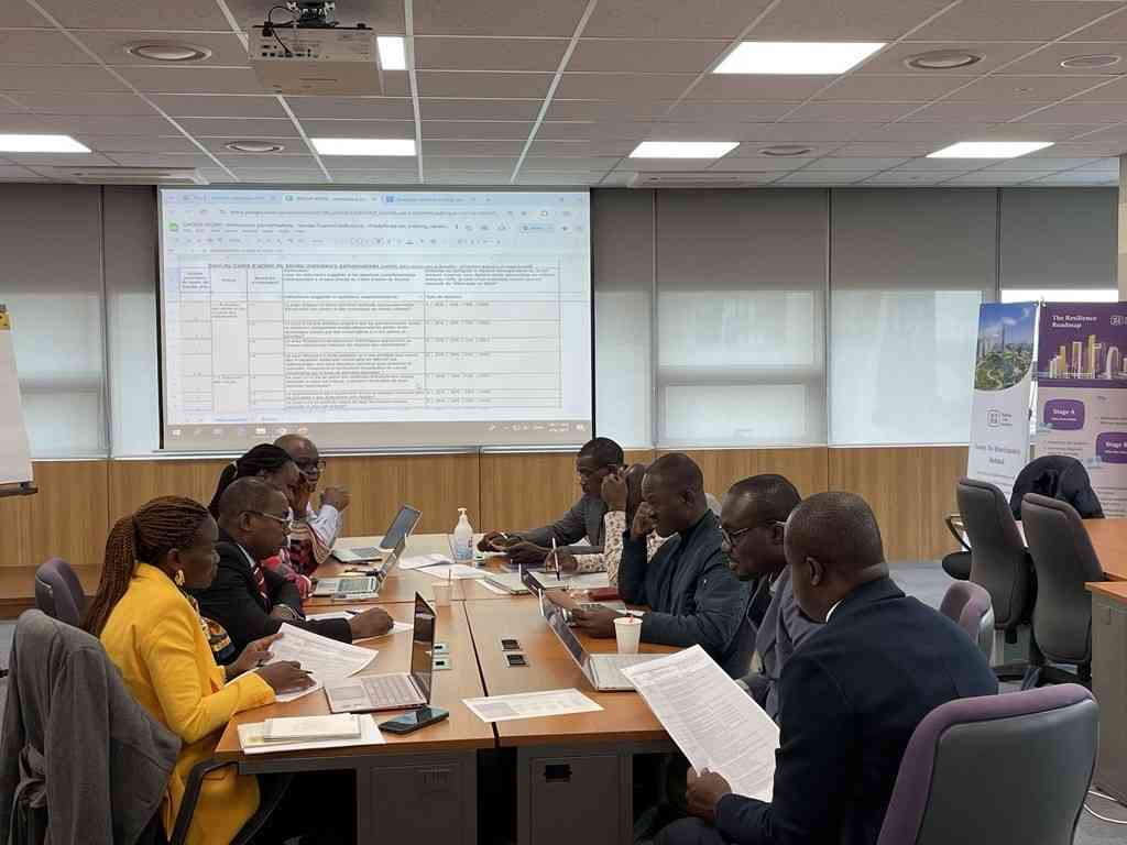 Togo officials in training session sitting around the table