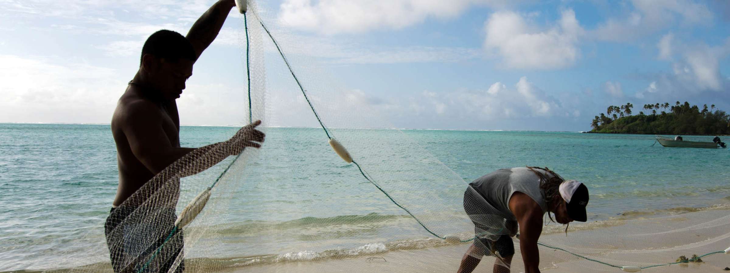 Men fishing on a beach