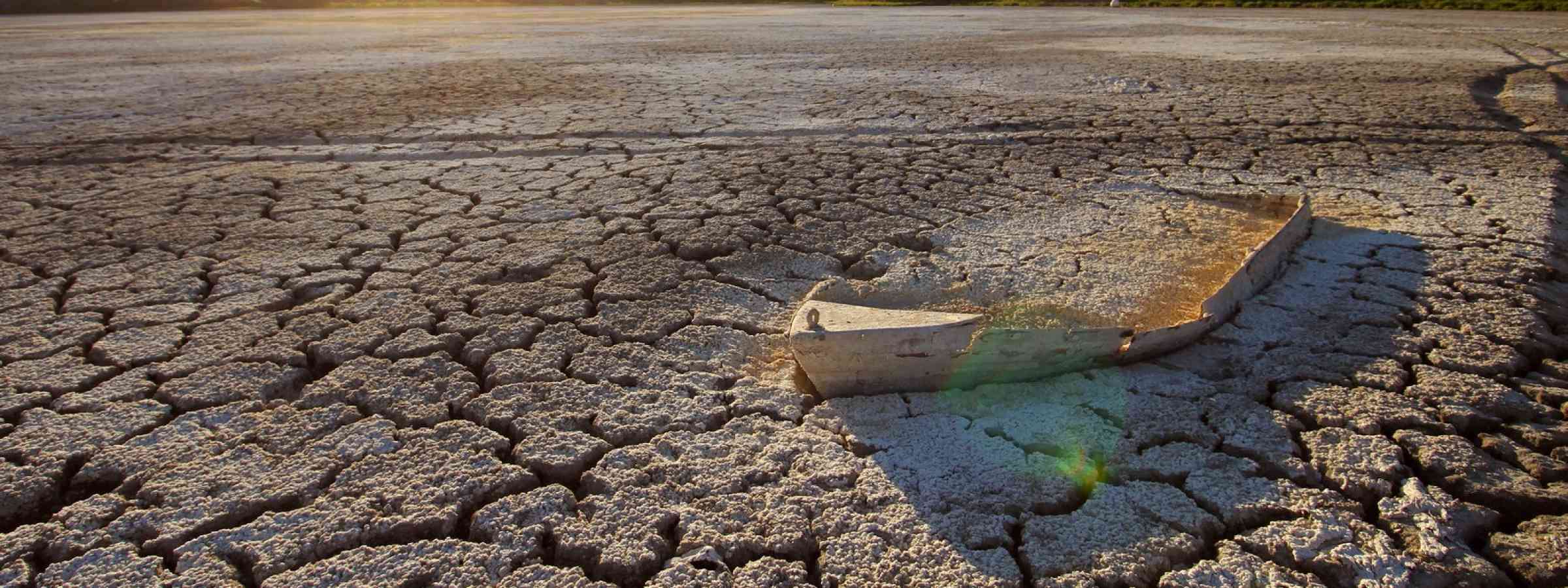A boat in drought-affected lake