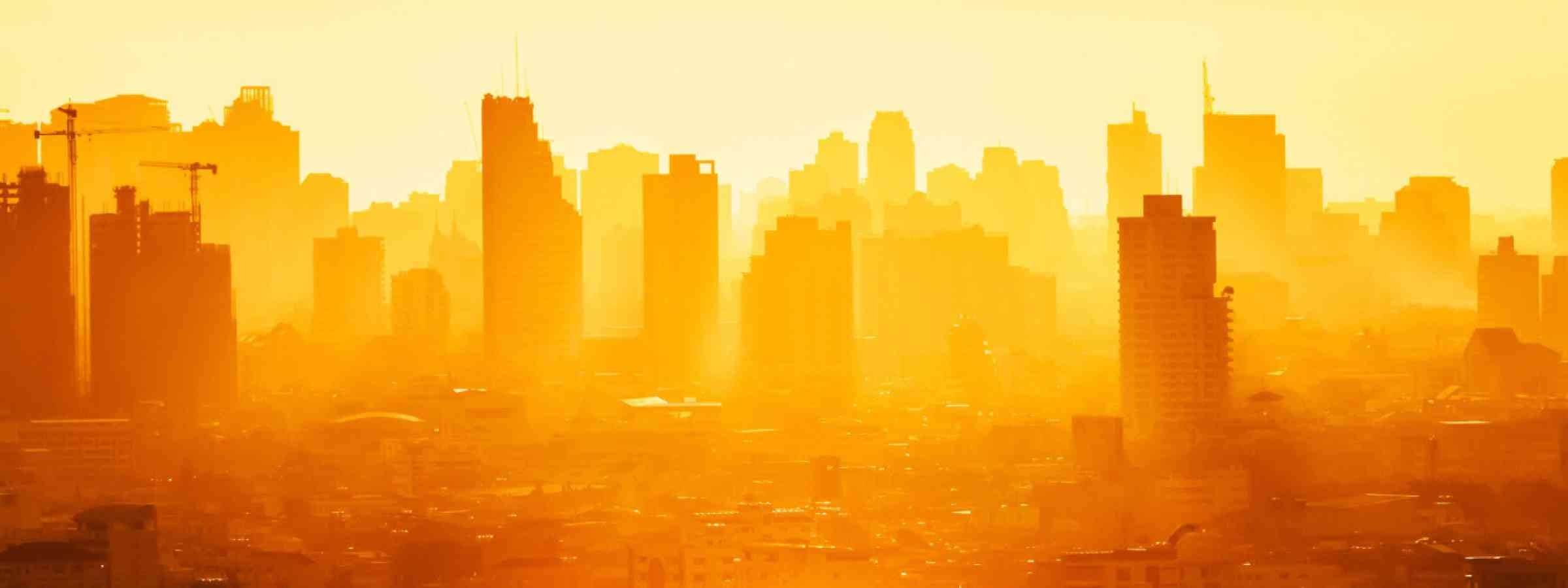 Sunrise over modern office buildings in business district center of Bangkok.