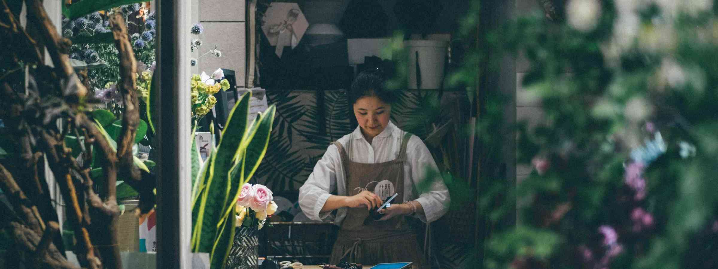 Woman in flower shop business Woman in flower shop business