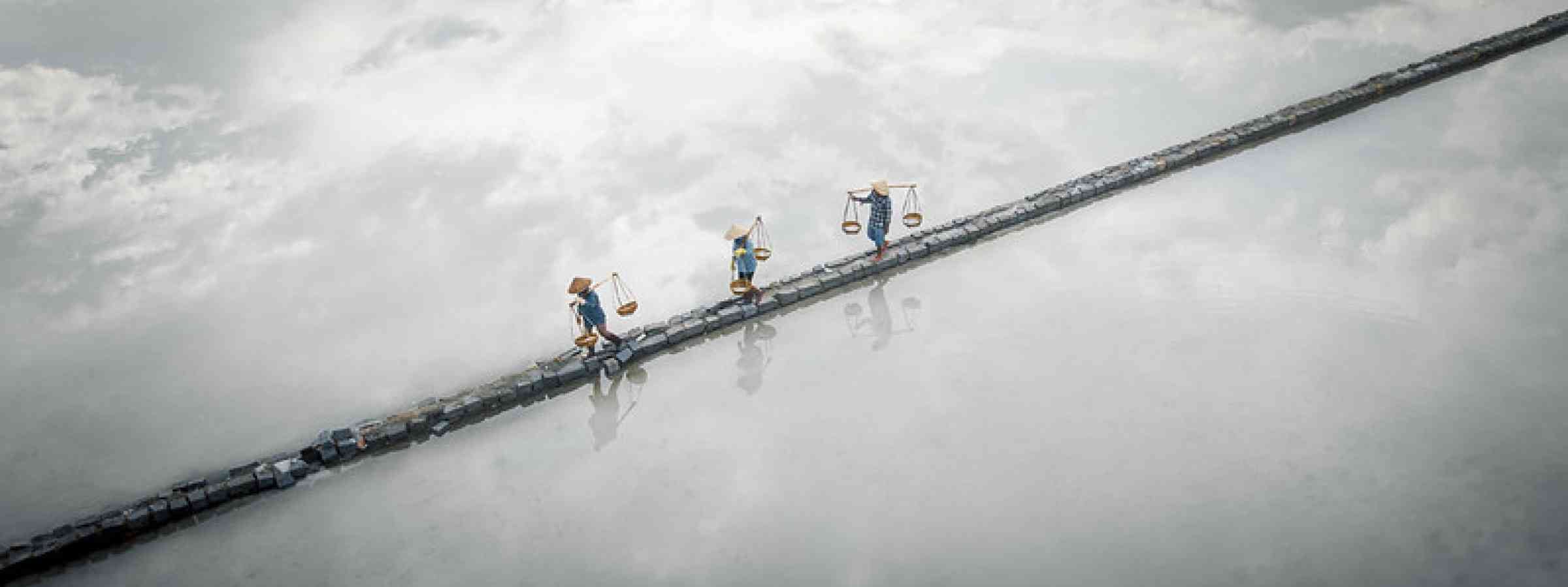 In Viet Nam, sun and seawater shape salt ponds that have sustained livelihoods for generations. In Viet Nam, sun and seawater shape salt ponds that have sustained livelihoods for generations.